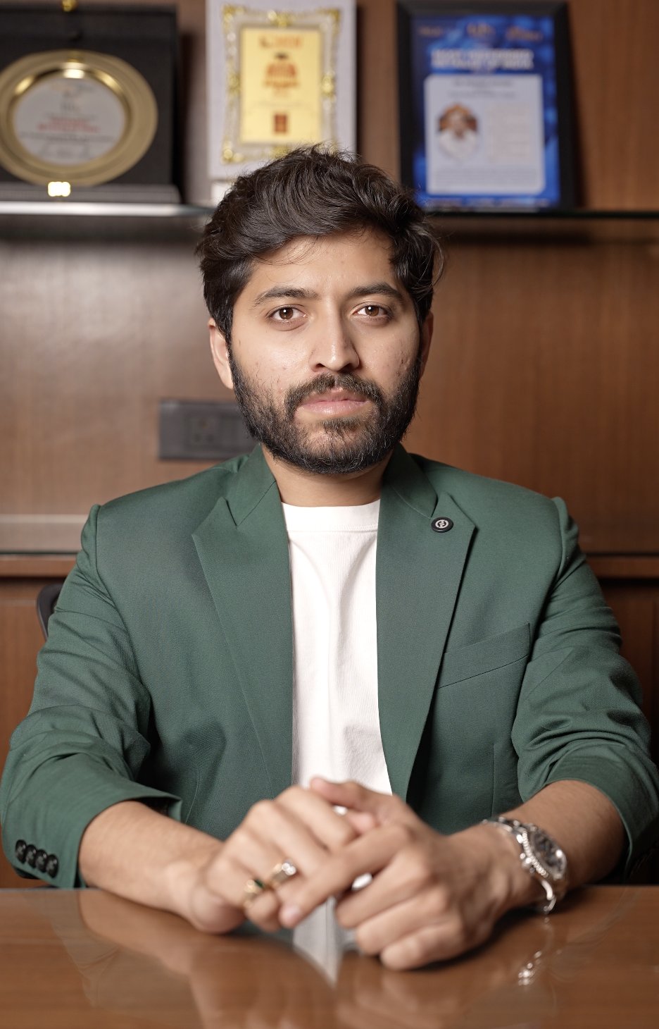 Karan Kothari Group director in a green blazer